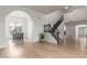 Open-concept floor plan featuring light wood floors and staircase at 5332 W Linda Ln, Chandler, AZ 85226