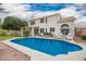 Backyard pool with plenty of seating and a view of the two-story home at 5332 W Linda Ln, Chandler, AZ 85226