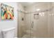 Modern bathroom with a frameless glass shower, tiled walls, and recessed lighting at 5518 E Lindstrom Ln # 2038, Mesa, AZ 85215