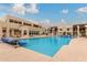 Beautiful community pool with lounge chairs and well-maintained landscape at 5518 E Lindstrom Ln # 2038, Mesa, AZ 85215