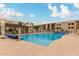 Resort-style community pool and sun deck with inviting lounge chairs for relaxation at 5518 E Lindstrom Ln # 2038, Mesa, AZ 85215