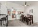 Dining room features dark wood table, four chairs, and open access to kitchen at 5518 E Lindstrom Ln # 2038, Mesa, AZ 85215