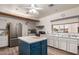Community kitchen with a kitchen island, stainless steel appliances, plenty of cabinet space, and a large window at 5518 E Lindstrom Ln # 2038, Mesa, AZ 85215