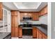 Kitchen boasts sleek stainless appliances, including a built-in microwave, and wood cabinets at 5518 E Lindstrom Ln # 2038, Mesa, AZ 85215
