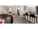 Inviting living room with neutral carpet and decor, featuring a bar area and comfortable seating for a relaxed atmosphere at 5518 E Lindstrom Ln # 2038, Mesa, AZ 85215