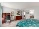 Comfortable main bedroom featuring a work desk, dresser, and ensuite bath access at 5518 E Lindstrom Ln # 2038, Mesa, AZ 85215