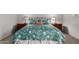 Relaxing main bedroom with floral bedding, matching nightstands, and soft lighting for a peaceful retreat at 5518 E Lindstrom Ln # 2038, Mesa, AZ 85215