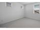 Bright bedroom features neutral carpet, white walls, and three windows offering natural light at 5710 N 84Th Ave, Glendale, AZ 85305
