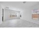 Bright, empty bedroom features beautiful marble floors and multiple windows at 5710 N 84Th Ave, Glendale, AZ 85305