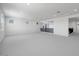 Spacious bonus room with neutral carpet and white walls featuring many windows for natural light at 5710 N 84Th Ave, Glendale, AZ 85305