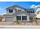 Charming two-story home with gray stucco, dark shutters, a two-car garage and low maintenance landscaping at 5710 N 84Th Ave, Glendale, AZ 85305