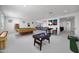 Large game room features a pool table, poker table, and ample space for entertaining at 5710 N 84Th Ave, Glendale, AZ 85305