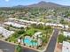 Residential area with palm trees, green spaces, and a community pool at 6257 E Catalina Dr, Scottsdale, AZ 85251