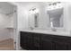Bathroom featuring dual sinks, a makeup vanity, and quartz countertops at 6349 N 78Th St # 123, Scottsdale, AZ 85250