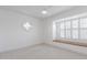 Light-filled bedroom features neutral walls and carpet, as well as a window seat at 6349 N 78Th St # 123, Scottsdale, AZ 85250