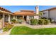 Exterior of property showcasing lush landscaping, a red tile roof, and a well-maintained lawn at 6349 N 78Th St # 123, Scottsdale, AZ 85250