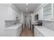 Bright kitchen featuring white cabinetry, stainless steel appliances, and marble countertops at 6349 N 78Th St # 123, Scottsdale, AZ 85250