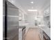Modern kitchen with white cabinetry, stainless steel appliances, and ample counter space at 6349 N 78Th St # 123, Scottsdale, AZ 85250