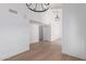 Open-concept living space with high ceilings, modern lighting, and sleek flooring at 6349 N 78Th St # 123, Scottsdale, AZ 85250