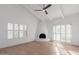 Bright living room showcasing a striking fireplace, vaulted ceilings, and large windows at 6349 N 78Th St # 123, Scottsdale, AZ 85250