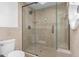 Newly renovated shower with glass doors and tiled surround at 6349 N 78Th St # 123, Scottsdale, AZ 85250