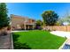 Lush backyard with a pristine lawn at 650 E Daniella E Dr, San Tan Valley, AZ 85140