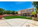 Lovely backyard oasis with a manicured lawn at 650 E Daniella E Dr, San Tan Valley, AZ 85140