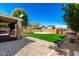 Expansive backyard features artificial turf, seating area, and privacy wall at 650 E Daniella E Dr, San Tan Valley, AZ 85140