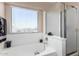 Bathroom featuring bathtub, shower, and a window at 650 E Daniella E Dr, San Tan Valley, AZ 85140