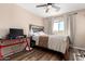 Bedroom with ceiling fan, window with blinds, and modern desk at 650 E Daniella E Dr, San Tan Valley, AZ 85140