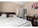 Cozy bedroom featuring neutral walls, wood furniture, and natural light at 650 E Daniella E Dr, San Tan Valley, AZ 85140