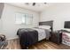 Bedroom featuring a window and wood flooring at 650 E Daniella E Dr, San Tan Valley, AZ 85140
