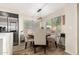 Cozy dining area with modern light fixture, stylish chairs and a view of the yard at 650 E Daniella E Dr, San Tan Valley, AZ 85140