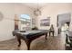 Game room features recessed lights, wood-look floors, pool table, and furniture at 650 E Daniella E Dr, San Tan Valley, AZ 85140