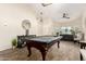 Game room features recessed lights, wood-look floors, pool table, and furniture at 650 E Daniella E Dr, San Tan Valley, AZ 85140