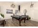 Game room features recessed lights, wood-look floors, pool table, and furniture at 650 E Daniella E Dr, San Tan Valley, AZ 85140