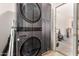 Laundry room with a gray, stacked washer and dryer at 650 E Daniella E Dr, San Tan Valley, AZ 85140