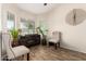 Sitting area features wood-look floors, natural light, and modern decor at 650 E Daniella E Dr, San Tan Valley, AZ 85140