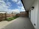 Paved patio area with white painted siding, perfect for outdoor relaxation and entertainment at 7129 W Meadowbrook Ave, Phoenix, AZ 85033