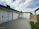 Paved patio area with white painted siding, perfect for outdoor relaxation and entertainment at 7129 W Meadowbrook Ave, Phoenix, AZ 85033