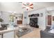 Inviting living room featuring tile floors, a ceiling fan, modern decor, and seamlessly integrates with the kitchen at 7929 S 70Th Dr, Laveen, AZ 85339