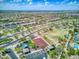 Aerial view showcasing the residential community with landscaped streets, green spaces, and neighborhood amenities at 8359 E Ingram Cir, Mesa, AZ 85207