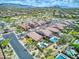 Aerial view of multiple homes in a neighborhood, featuring mountain views and a desert landscape at 8359 E Ingram Cir, Mesa, AZ 85207