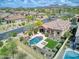 Aerial view of a home featuring a swimming pool, and an outdoor seating area with desert landscaping at 8359 E Ingram Cir, Mesa, AZ 85207