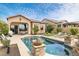 Inviting backyard with a sparkling pool, patio furniture, and well-manicured landscaping at 8359 E Ingram Cir, Mesa, AZ 85207