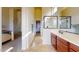 Bright bathroom features a glass enclosed shower, wood vanity with dual sinks, and neutral color palette at 8359 E Ingram Cir, Mesa, AZ 85207