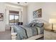 Cozy bedroom featuring a comfortable bed, bedside table, and a sunny window at 8359 E Ingram Cir, Mesa, AZ 85207