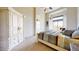 Bright bedroom features a large bed, an armoire, neutral walls, and carpet floors at 8359 E Ingram Cir, Mesa, AZ 85207
