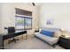 Bedroom featuring a black desk and gray sofa with large window to the outside at 8359 E Ingram Cir, Mesa, AZ 85207