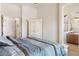 Spacious bedroom leads to a full ensuite bathroom and walk-in closet at 8359 E Ingram Cir, Mesa, AZ 85207